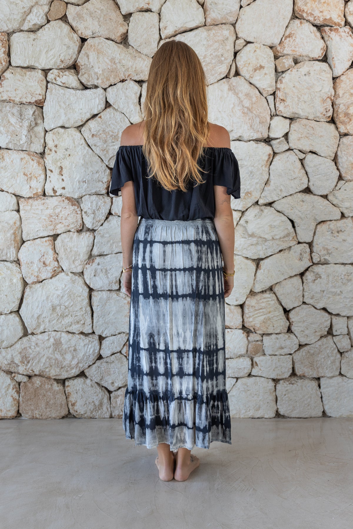 Womens tie dye skirt in grey featuring a smocked waist and button down front closing