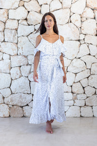 Womens elegant long length dress in white polka dot featuring cold shoulder sleeves, an elasticated waist, detachable belt detail and frill detailing 