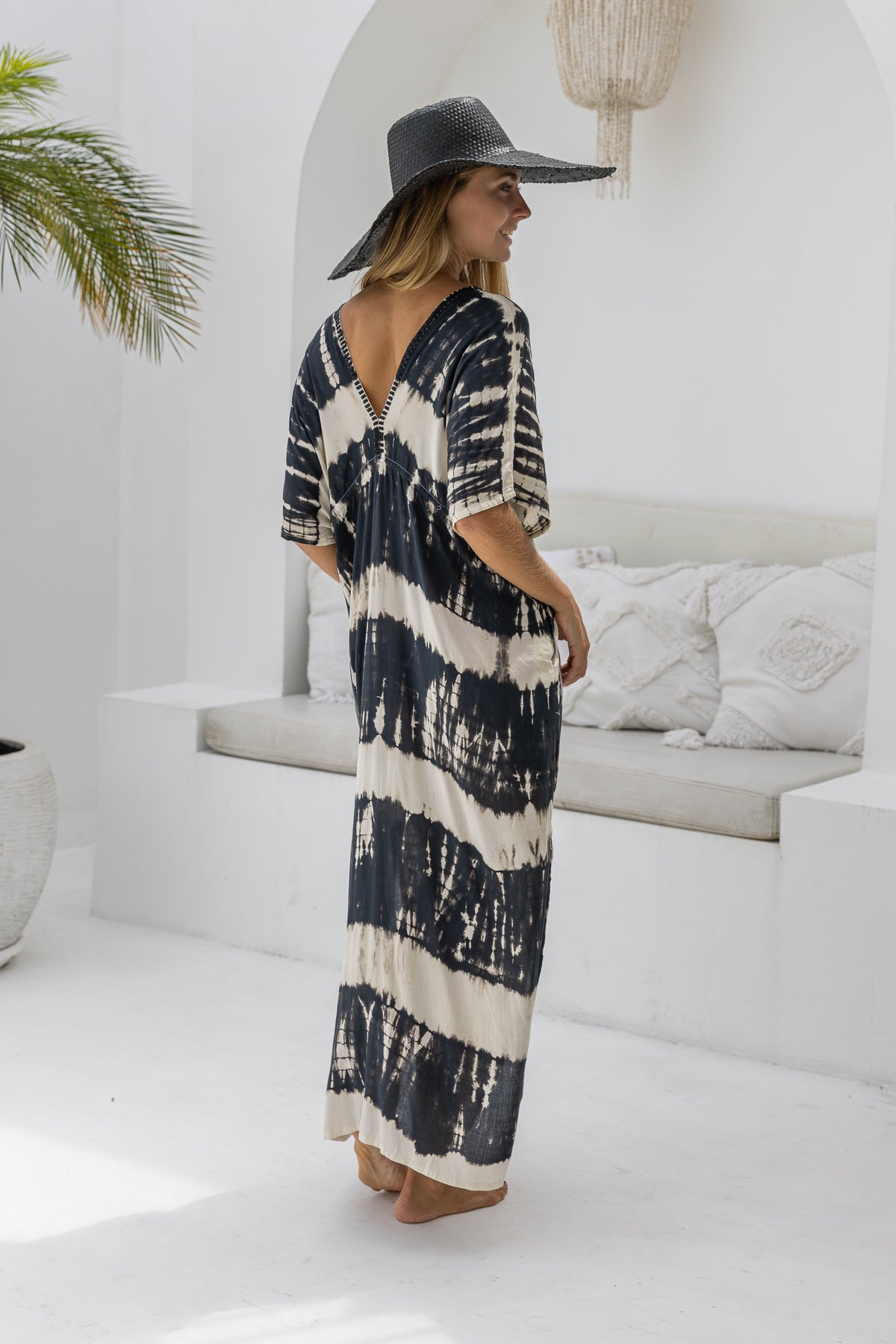 womens oversize maxi length tie dye kaftan in black and cream featuring a hand beaded neckline, pull tie detail and side pockets

