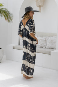 womens oversize maxi length tie dye kaftan in black and cream featuring a hand beaded neckline, pull tie detail and side pockets

