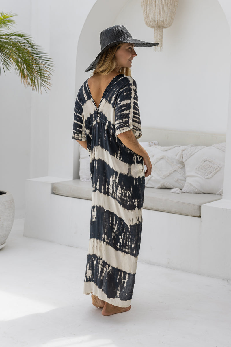 womens oversize maxi length tie dye kaftan in black and cream featuring a hand beaded neckline, pull tie detail and side pockets


