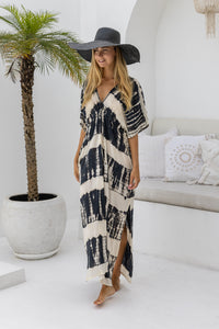 womens oversize maxi length tie dye kaftan in black and cream featuring a hand beaded neckline, pull tie detail and side pockets

