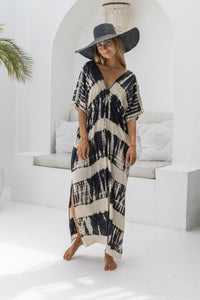 womens oversize maxi length tie dye kaftan in black and cream featuring a hand beaded neckline, pull tie detail and side pockets

