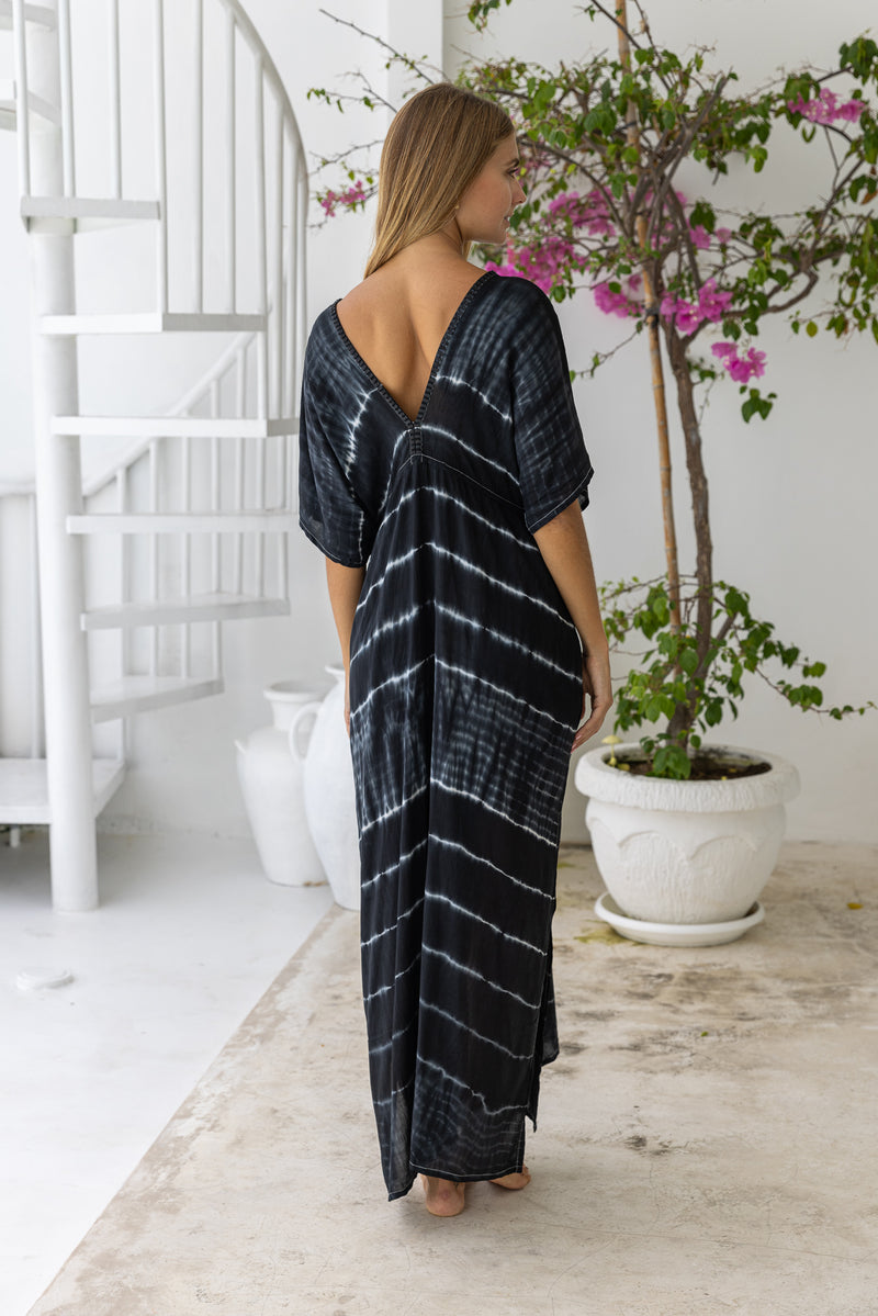 womens oversize maxi length tie dye kaftan in ink black and featuring a hand beaded neckline, pull tie detail and side pockets

