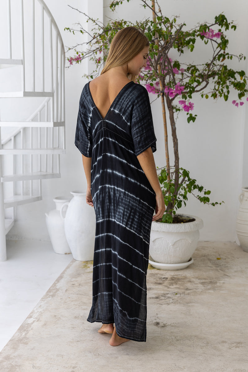womens oversize maxi length tie dye kaftan in ink black and featuring a hand beaded neckline, pull tie detail and side pockets

