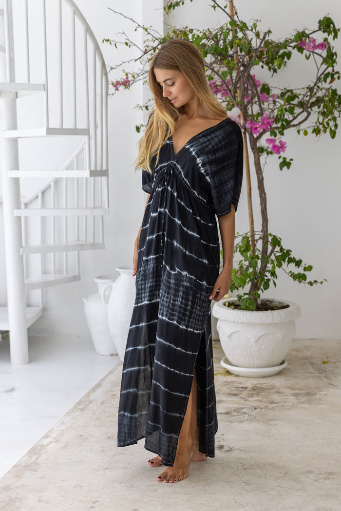 womens oversize maxi length tie dye kaftan in ink black and featuring a hand beaded neckline, pull tie detail and side pockets

