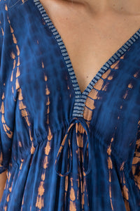 womens oversize maxi length tie dye kaftan in ink black and featuring a hand beaded neckline, pull tie detail and side pockets

