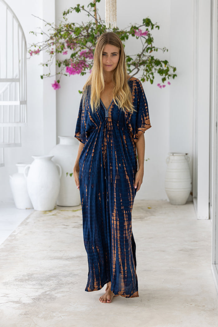 womens oversize maxi length tie dye kaftan in ink black and featuring a hand beaded neckline, pull tie detail and side pockets

