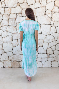 Womens full length tie dye summer dress in aqua blue featuring a hand beaded v neckline, pull ties under the bust, short sleeves and side splits