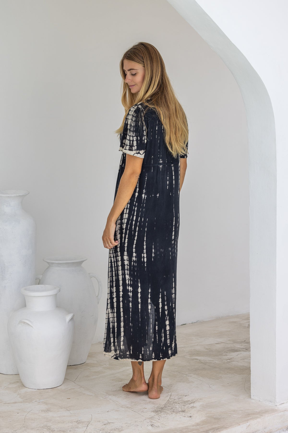 womens full length tie dye summer dress in black featuring a hand beaded v neckline, pull ties under the bust, short sleeves, pockets and side splits