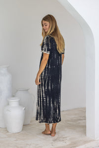 womens full length tie dye summer dress in black featuring a hand beaded v neckline, pull ties under the bust, short sleeves, pockets and side splits