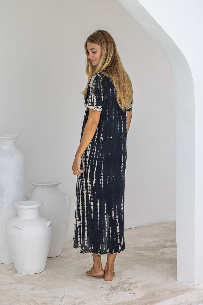 womens full length tie dye summer dress in black featuring a hand beaded v neckline, pull ties under the bust, short sleeves, pockets and side splits