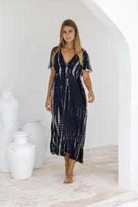 womens full length tie dye summer dress in black featuring a hand beaded v neckline, pull ties under the bust, short sleeves, pockets and side splits
