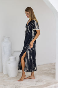 womens full length tie dye summer dress in black featuring a hand beaded v neckline, pull ties under the bust, short sleeves, pockets and side splits