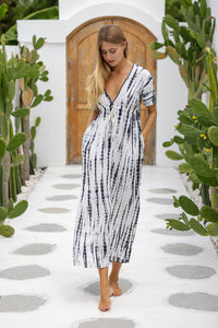 womens full length tie dye summer dress in black featuring a hand beaded v neckline, pull ties under the bust, short sleeves, pockets and side splits