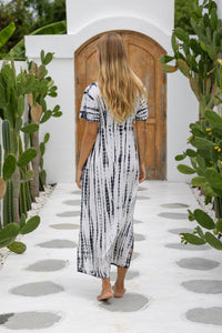 womens full length tie dye summer dress in black featuring a hand beaded v neckline, pull ties under the bust, short sleeves, pockets and side splits