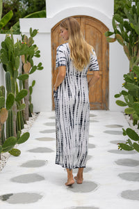 womens full length tie dye summer dress in black featuring a hand beaded v neckline, pull ties under the bust, short sleeves, pockets and side splits