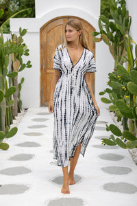 womens full length tie dye summer dress in black featuring a hand beaded v neckline, pull ties under the bust, short sleeves, pockets and side splits