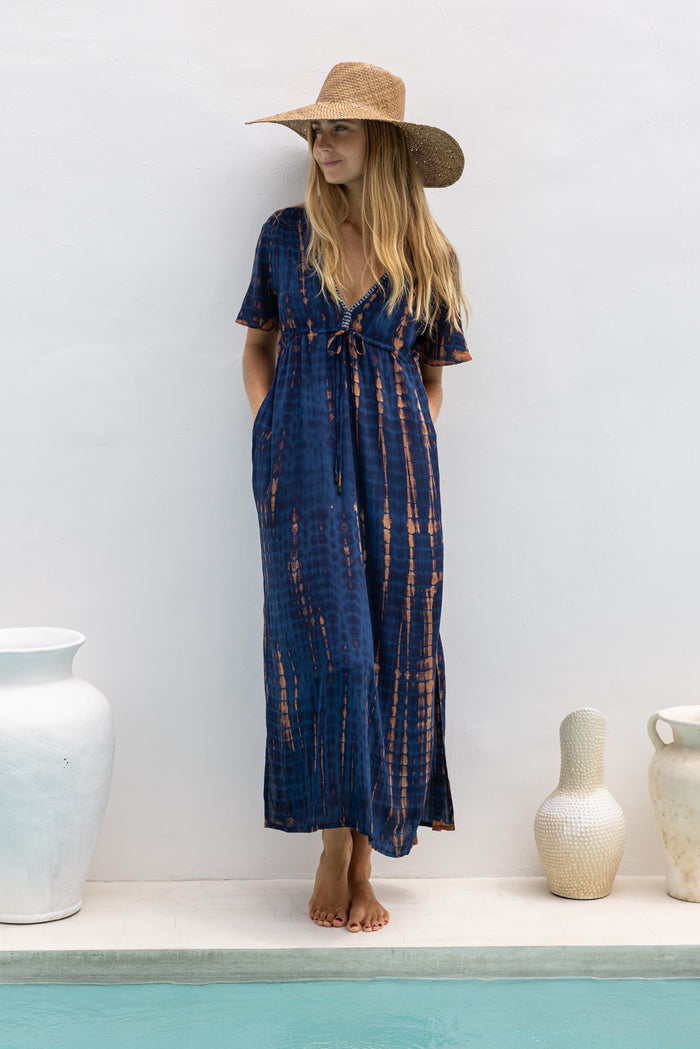 womens full length tie dye summer dress in black featuring a hand beaded v neckline, pull ties under the bust, short sleeves, pockets and side splits