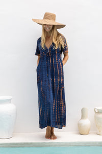 womens full length tie dye summer dress in black featuring a hand beaded v neckline, pull ties under the bust, short sleeves, pockets and side splits