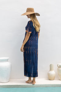 womens full length tie dye summer dress in black featuring a hand beaded v neckline, pull ties under the bust, short sleeves, pockets and side splits