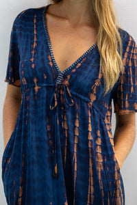 womens full length tie dye summer dress in black featuring a hand beaded v neckline, pull ties under the bust, short sleeves, pockets and side splits