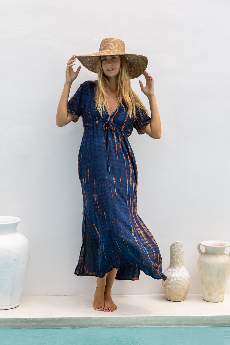 womens full length tie dye summer dress in black featuring a hand beaded v neckline, pull ties under the bust, short sleeves, pockets and side splits