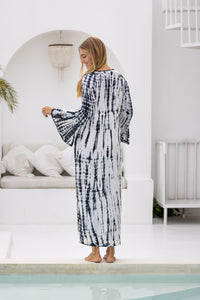 womens full length tie dye summer dress in black featuring a hand beaded v neckline, pull ties under the bust, trumpet sleeves, pockets and side splits