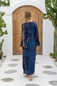 womens full length tie dye summer dress in black featuring a hand beaded v neckline, pull ties under the bust, trumpet sleeves, pockets and side splits
