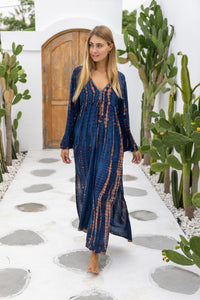 womens full length tie dye summer dress in black featuring a hand beaded v neckline, pull ties under the bust, trumpet sleeves, pockets and side splits
