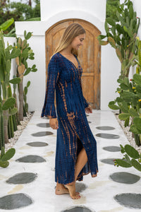 womens full length tie dye summer dress in black featuring a hand beaded v neckline, pull ties under the bust, trumpet sleeves, pockets and side splits