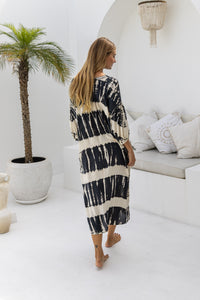 womens mid length oversize tie dye dress in black and cream featuring a hand beaded v neckline, 3/4 length sleeves and pockets