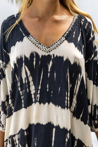 womens mid length oversize tie dye dress in black and cream featuring a hand beaded v neckline, 3/4 length sleeves and pockets