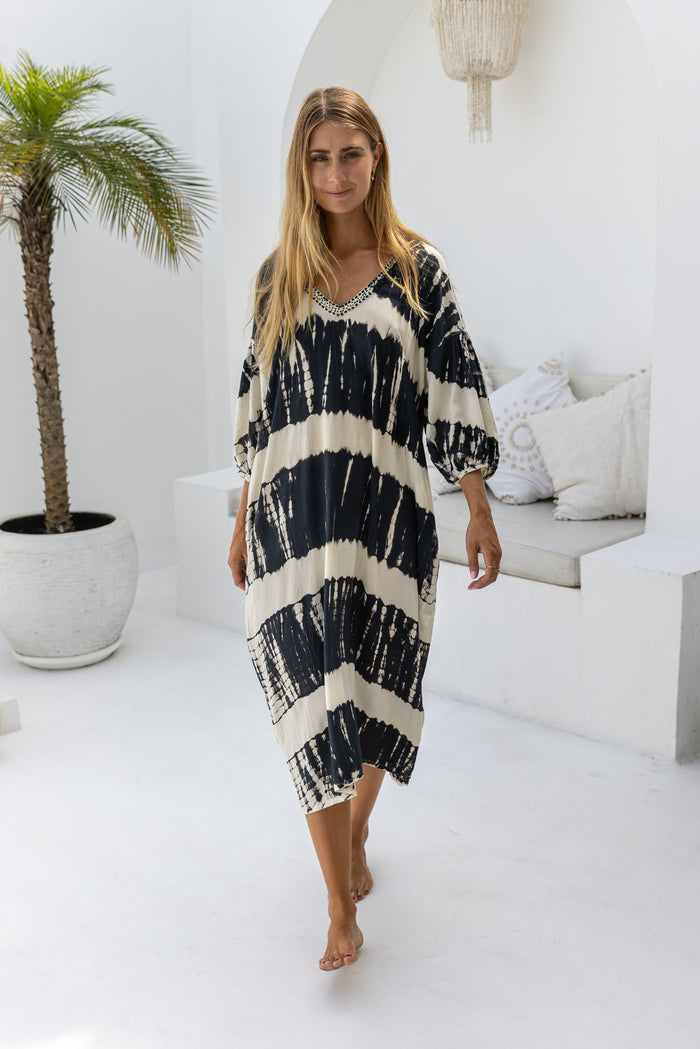 womens mid length oversize tie dye dress in black and cream featuring a hand beaded v neckline, 3/4 length sleeves and pockets