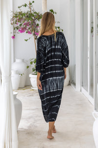 womens mid length oversize tie dye dress in black and cream featuring a hand beaded v neckline, 3/4 length sleeves and pockets