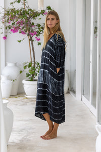 womens mid length oversize tie dye dress in black and cream featuring a hand beaded v neckline, 3/4 length sleeves and pockets