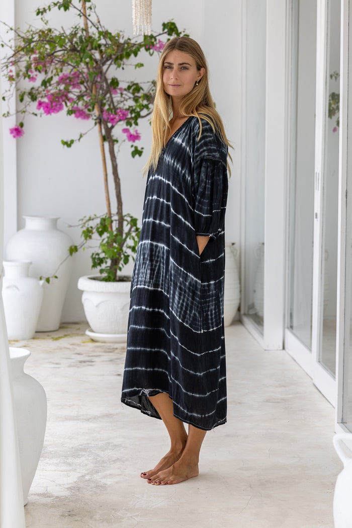 womens mid length oversize tie dye dress in black and cream featuring a hand beaded v neckline, 3/4 length sleeves and pockets