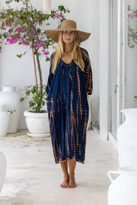 womens mid length oversize tie dye dress in navy blue and brown featuring a hand beaded v neckline, 3/4 length sleeves and pockets