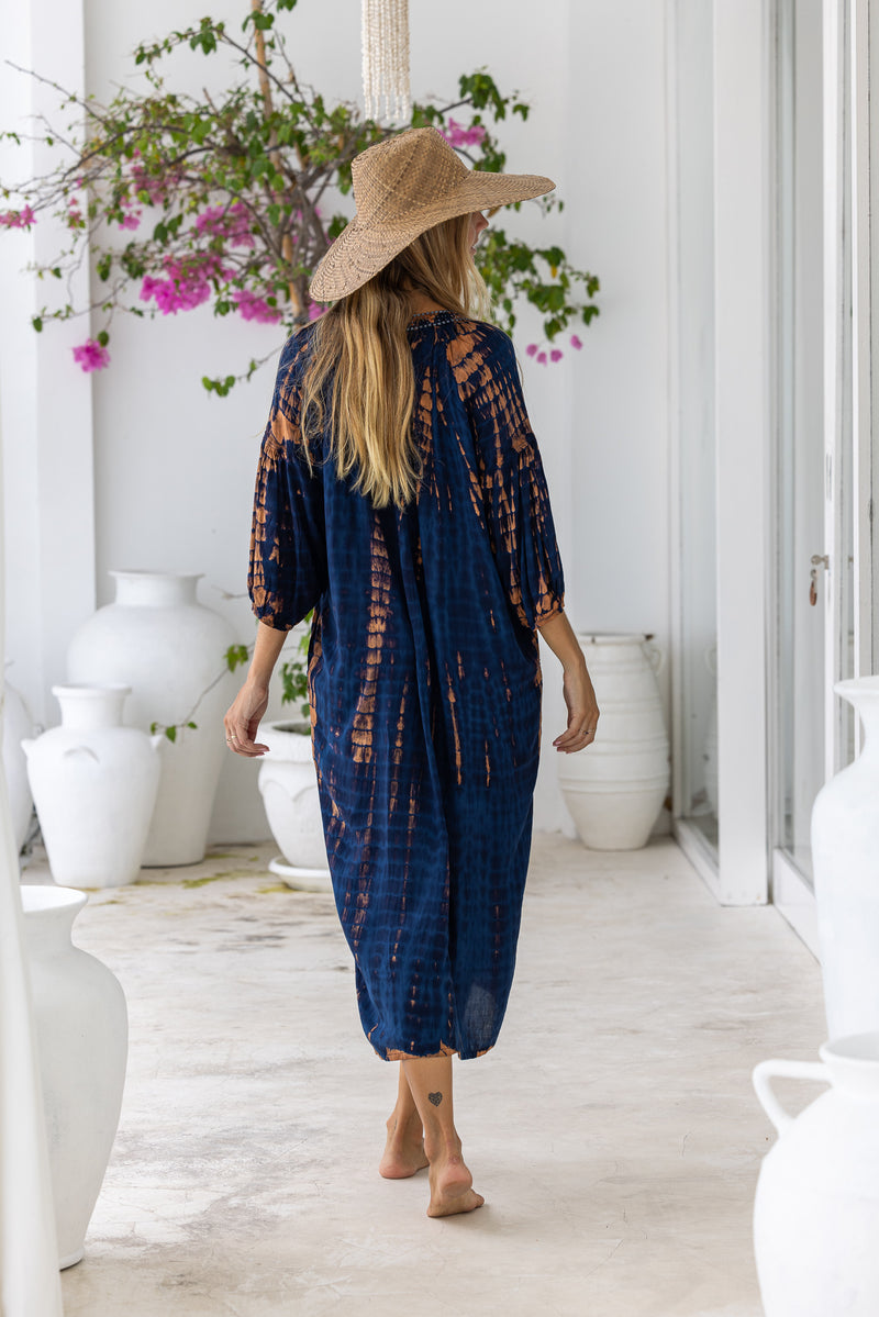 womens mid length oversize tie dye dress in navy blue and brown featuring a hand beaded v neckline, 3/4 length sleeves and pockets