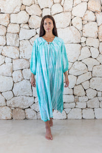 Womens tie dye oversize dress in aqua blue featuring tie detail, side pockets and long sleeves