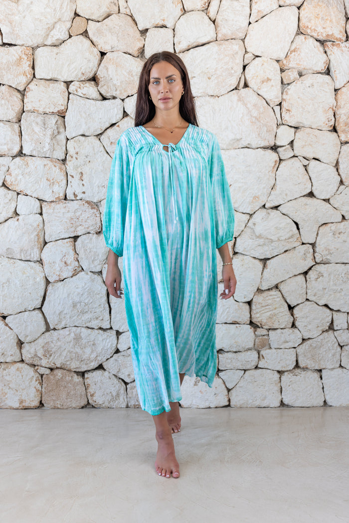 Womens tie dye oversize dress in aqua blue featuring tie detail, side pockets and long sleeves