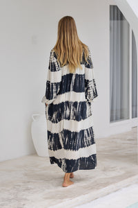 tie dye oversize dress in black and cream featuring tie detail, side pockets and long sleeves