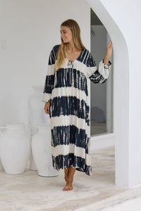 tie dye oversize dress in black and cream featuring tie detail, side pockets and long sleeves