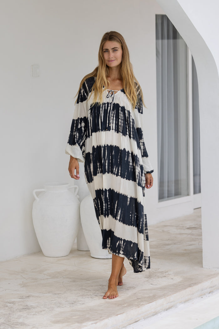 tie dye oversize dress in black and cream featuring tie detail, side pockets and long sleeves