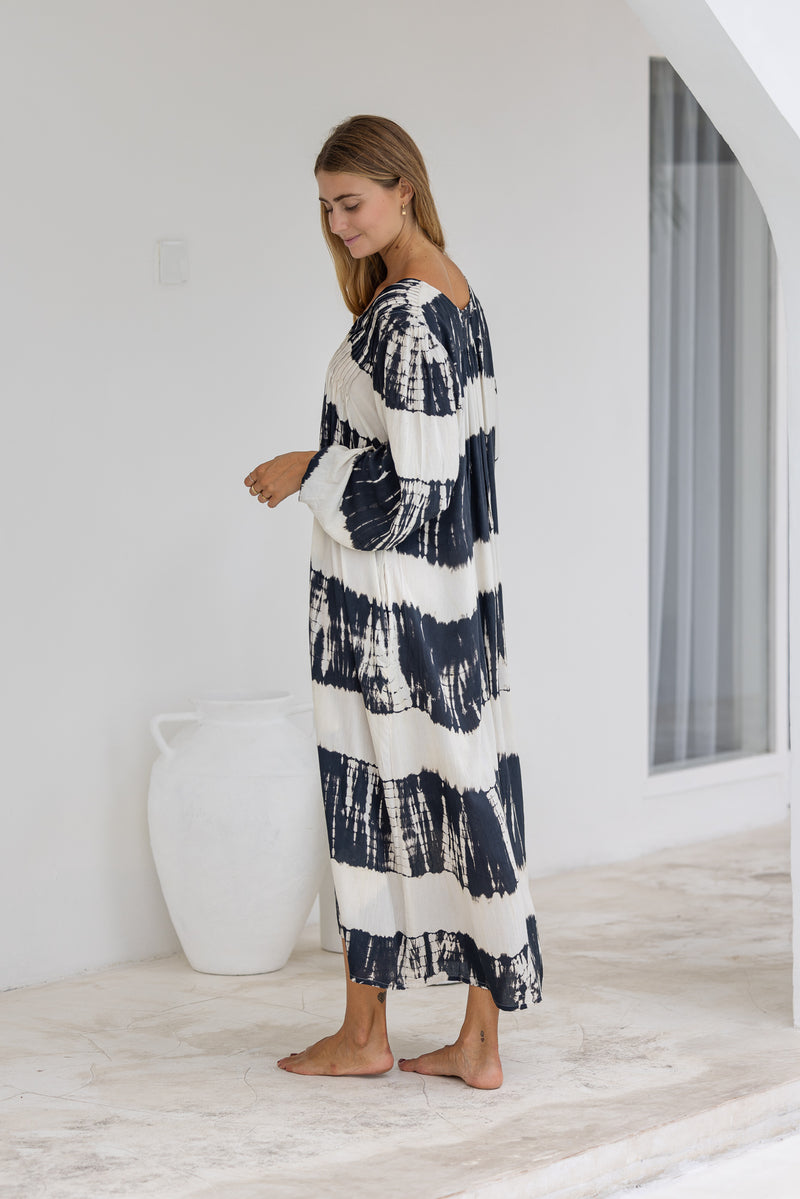 tie dye oversize dress in black and cream featuring tie detail, side pockets and long sleeves