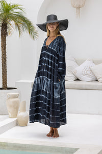 tie dye oversize dress in black and cream featuring tie detail, side pockets and long sleeves