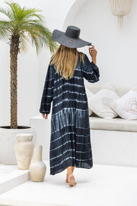 tie dye oversize dress in black and cream featuring tie detail, side pockets and long sleeves