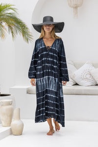 tie dye oversize dress in black and cream featuring tie detail, side pockets and long sleeves