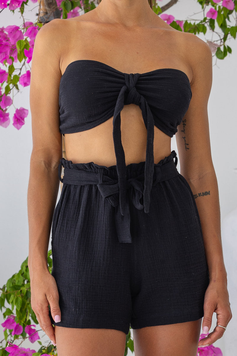 Womens super soft, 100% cotton high waited Paperbag shorts in black, featuring an elasticated waist with a belt and side pockets