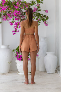 Womens super soft, 100% cotton high waited Paperbag shorts in brick, featuring an elasticated waist with a belt and side pockets
